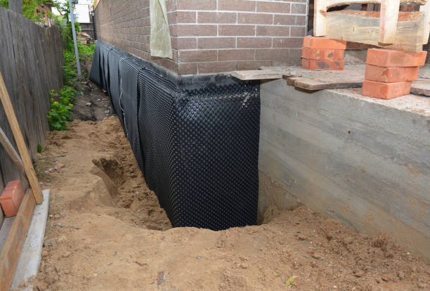 Happy homeowners after waterproofing job in Sodus